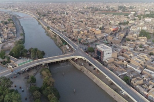 View of a canal bridge near Larkana with agricultural fields in the background