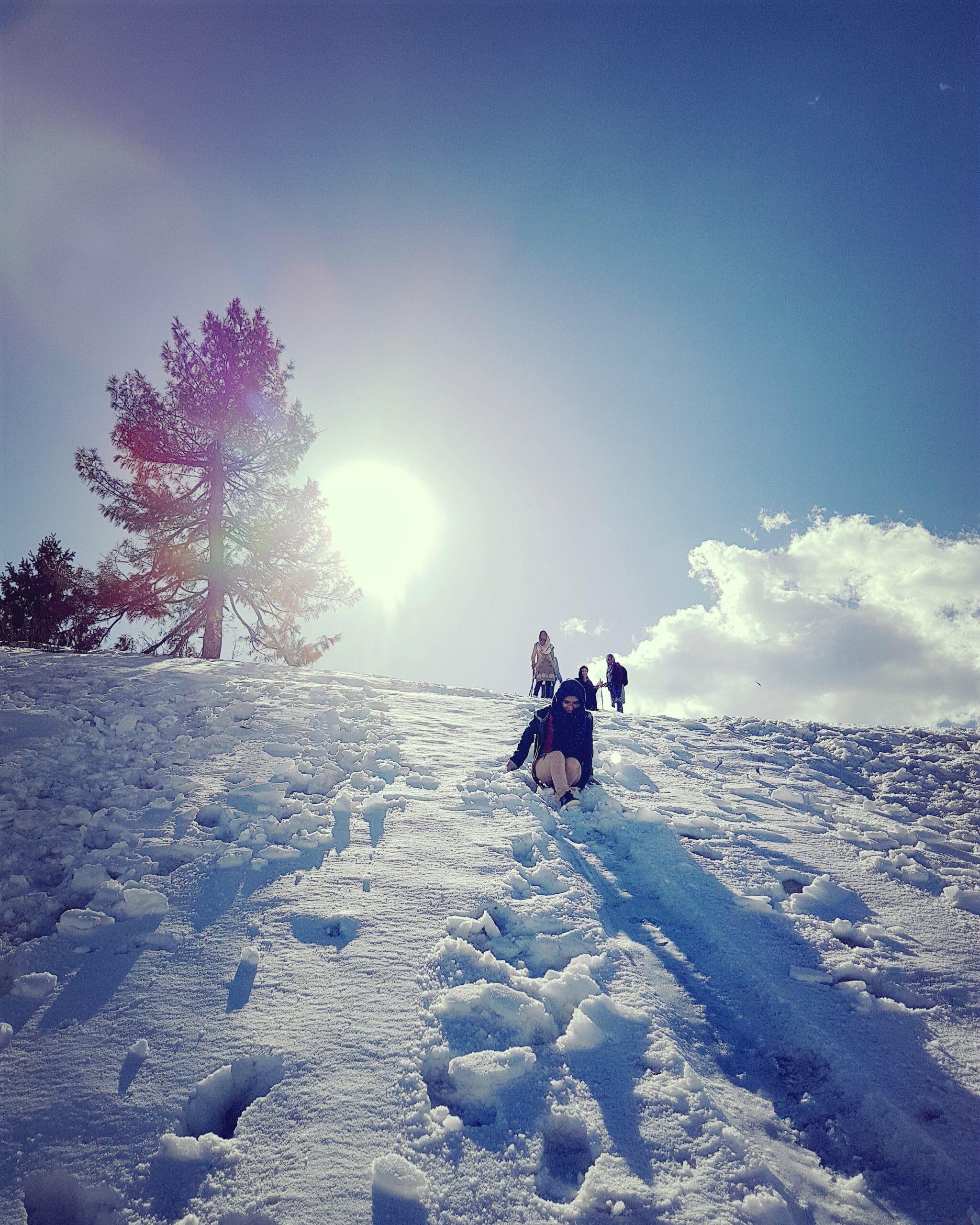Hikers walking uphill on the Mushkpuri trail near Nathia Gali